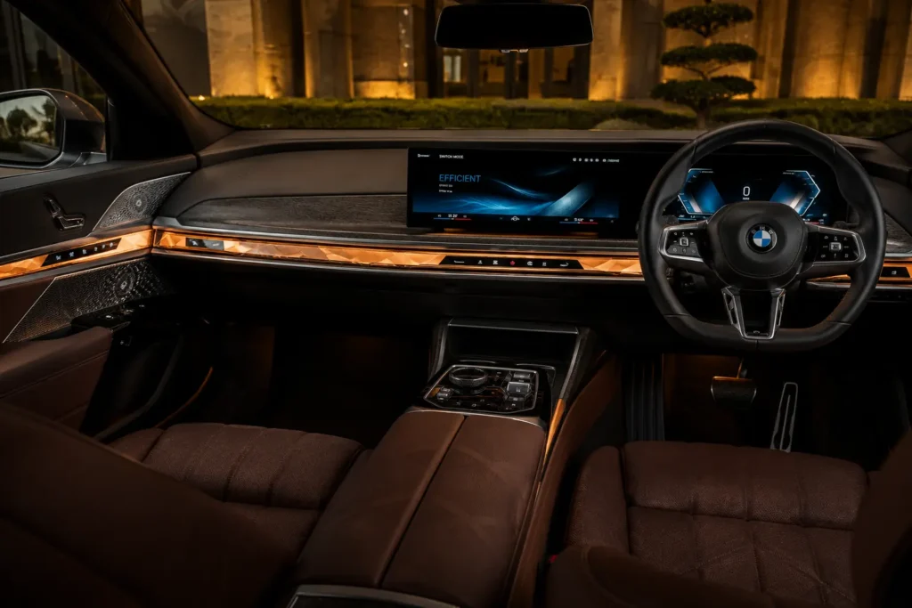 BMW i7 dashboard featuring curved display and illuminated interaction bar.