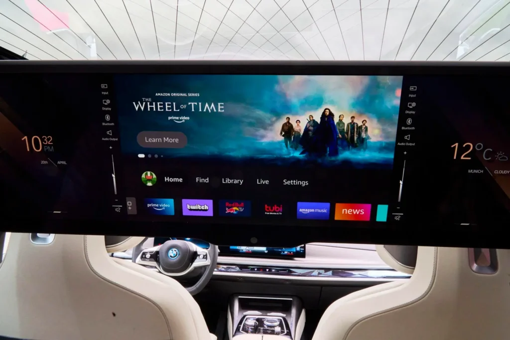 BMW i7 31.3-inch 8K Theatre Screen deployed for rear passengers.
