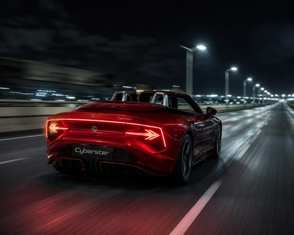 MG Cyberster accelerating rapidly on a highway at night.