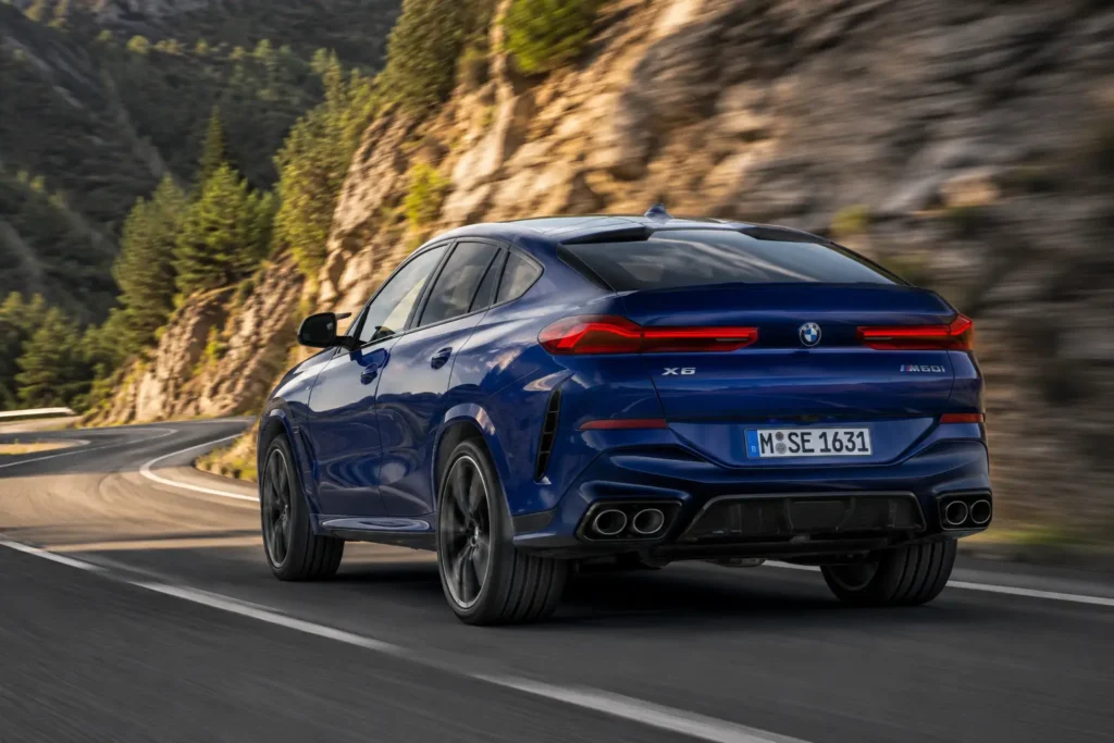 BMW X6 M60i driving performance on a mountain road