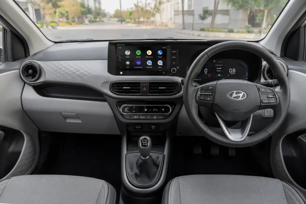 Hyundai Aura dual-tone dashboard with 8-inch touchscreen infotainment system and steering controls